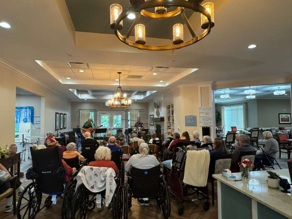 Lakeshore Woods seniors gathered together enjoying live music.